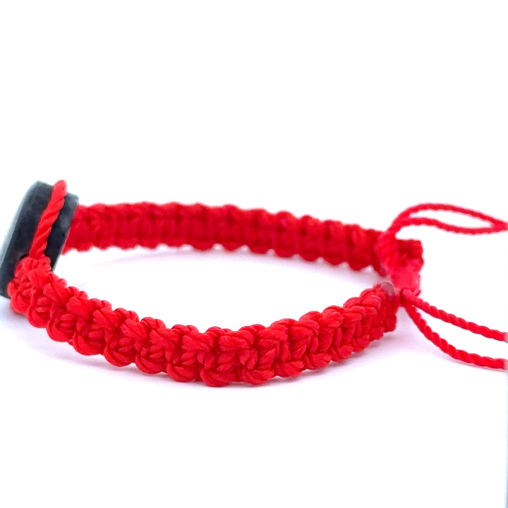 Handmade red Witches Knot Bracelet with wood charm symbolizing faith, unity, and divine protection.